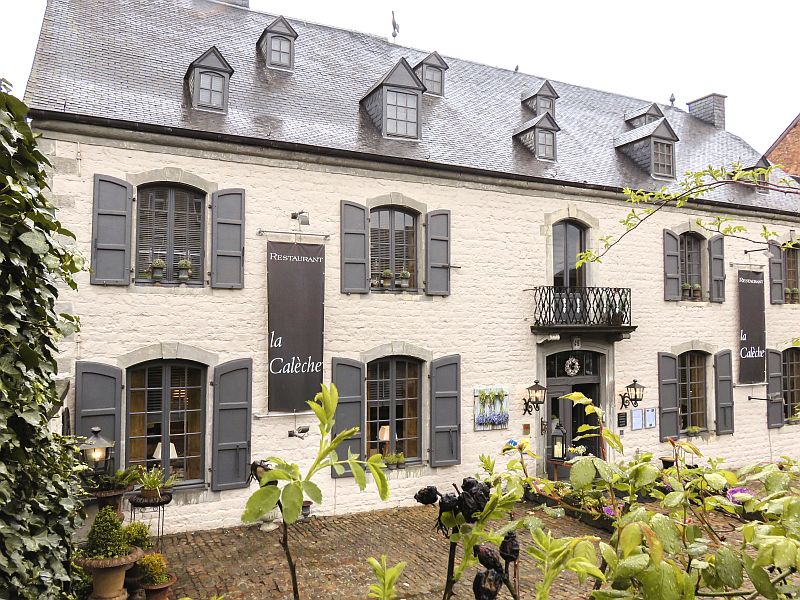 Facade of a hotel with shutters, Hotel La Male Poste in Rochefort, Wallonia 