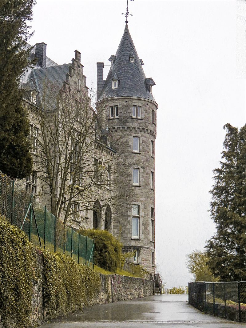 A castle tower on a rainy day. The Castle of Rochefort, Belgium, Wallonia