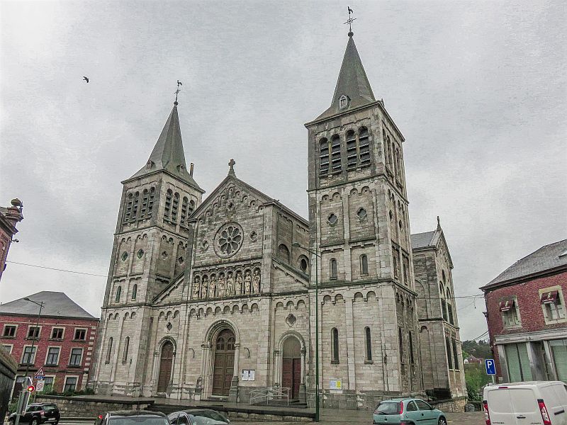 Impressive white church against a grey sky, Notre Dame de la Visitation Church in Rochefort, Belgium - Wallonia