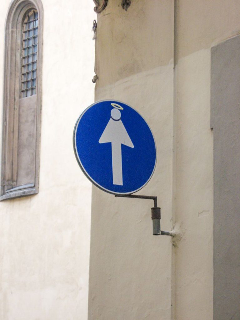 a road sign made as an art in the form of an angel; Clet Street Sign Art in Florence