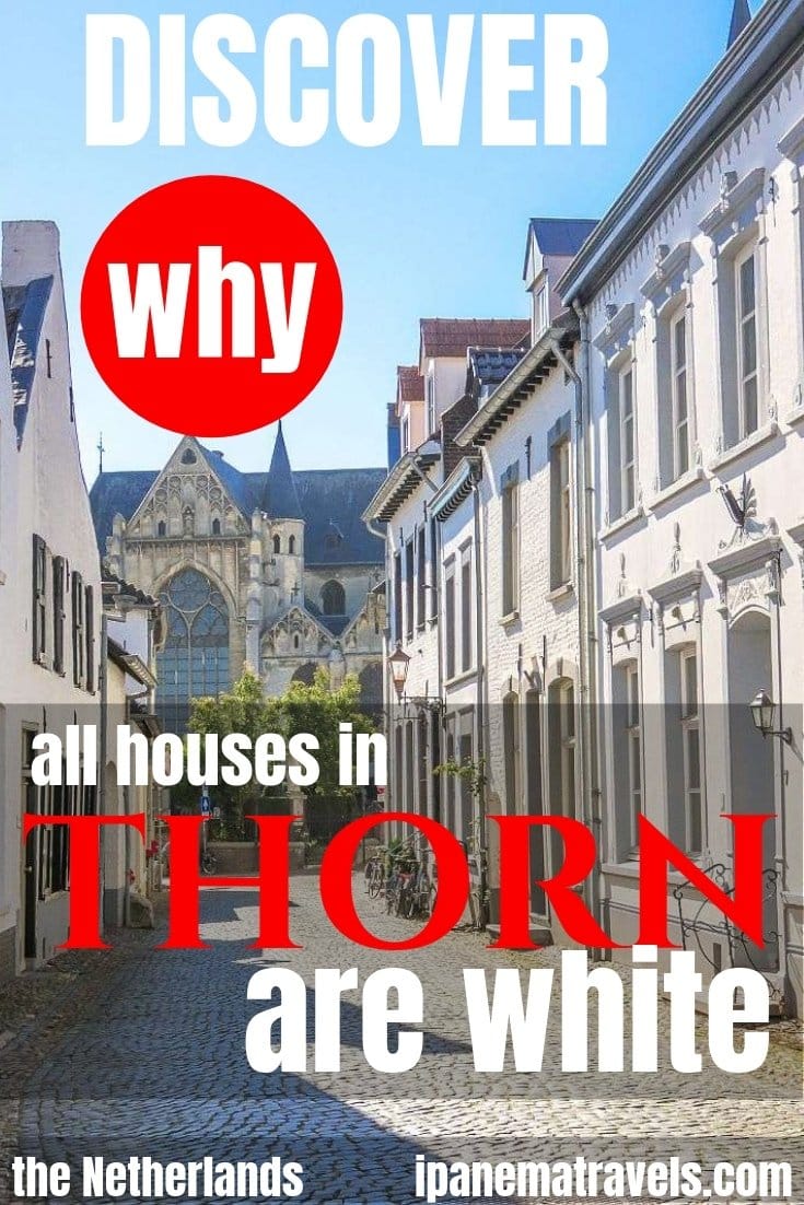 a cobblestone street with white hoses on both sides and overlay text: Discover why all houses in Thorn are white