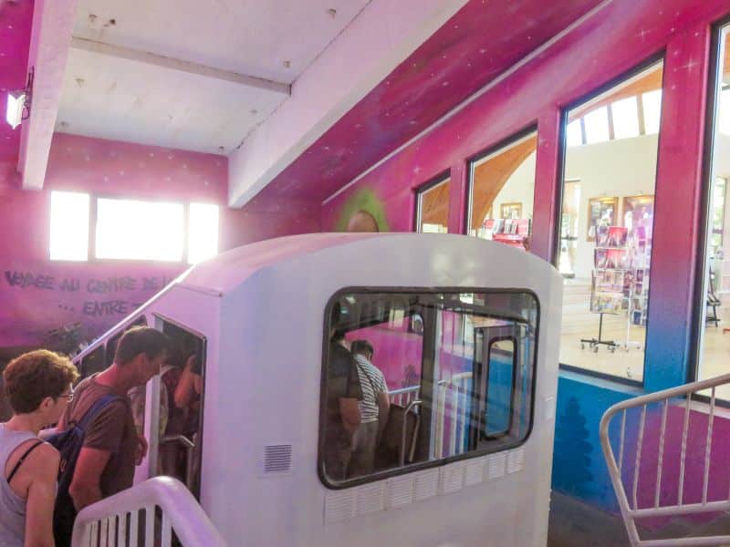 a carriage of a funicalur with people getting in