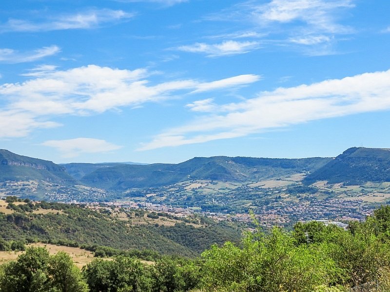 beautiful scenery with high plateaus and a town in the valley, France near Millau