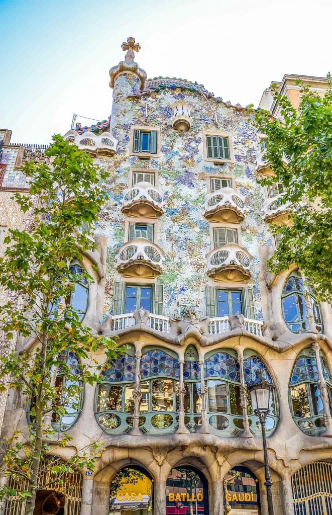 a colorful house in blue shades with curved balconies, Casa Batllo of Gaudi in Barcelona, Spain