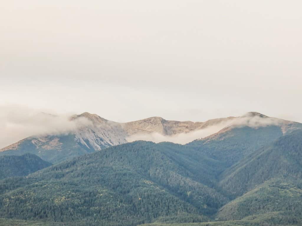 mountainous tops covered with last year's snow and clouds