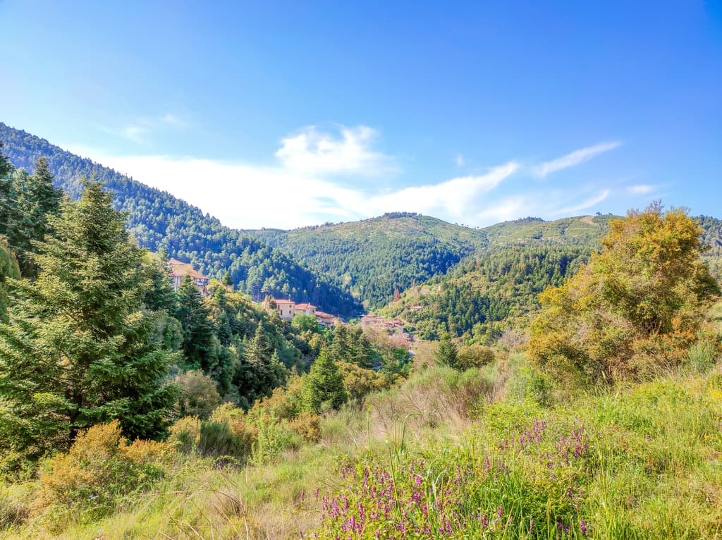 green mountains and a small village in a valley; Discovering beautiful Peloponnese in 4 days, getting off-the-beaten track in Greece